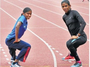 GEARING UP: Tintu Luka (left) and M.R. Poovamma warm up during a practice session on the eve of the 55th National inter-State athletic meet on Thursday. Photo: R. Ragu / The Hindu