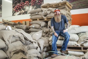 Bodhi Leaf founder Steve Sims sits among coffee beans he has imported from around the world at his facility in Orange on Thursday, December 1, 2016. (Photo by Nick Agro, Orange County Register/SCNG)