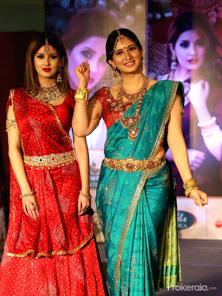 Actress Harshika Poonacha walks the ramp during a jewelry show