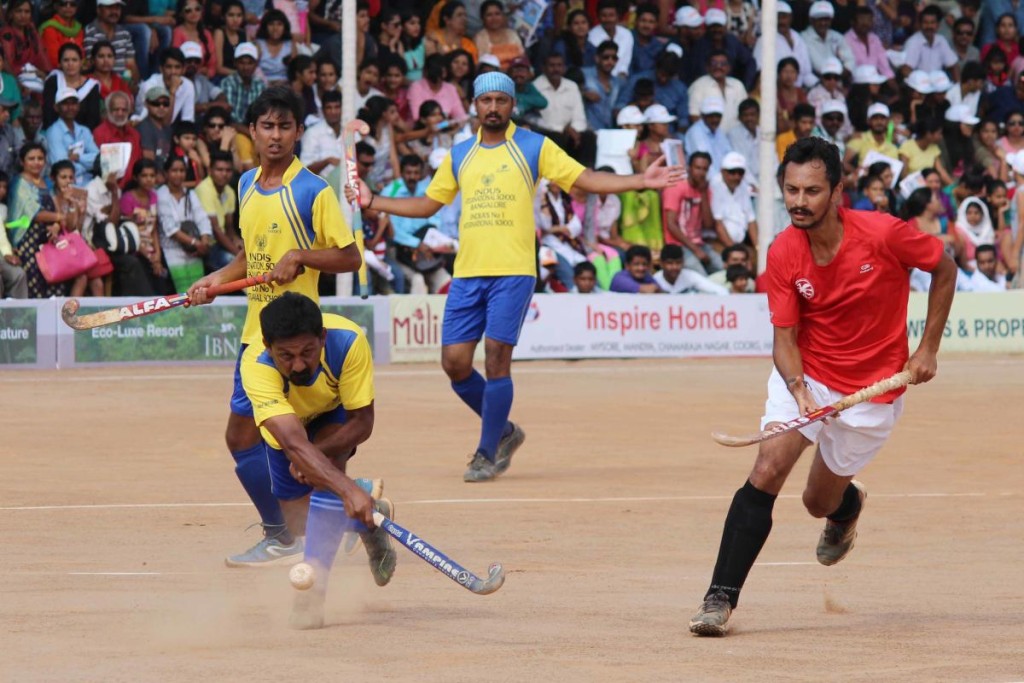 Aiming for a Goal: A match in progress during the Kodava Hockey Festival 2016 in Madikeri, Kodagu. / Photos by DH, Niran Shantheyanda