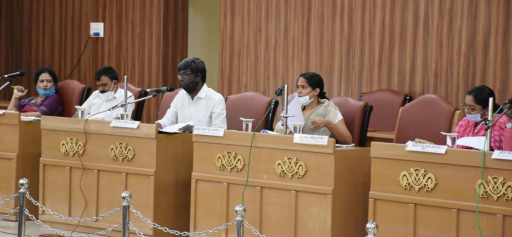 Minister Kota Srinivas Poojary conducts a review meeting in Madikeri on Wednesday. 